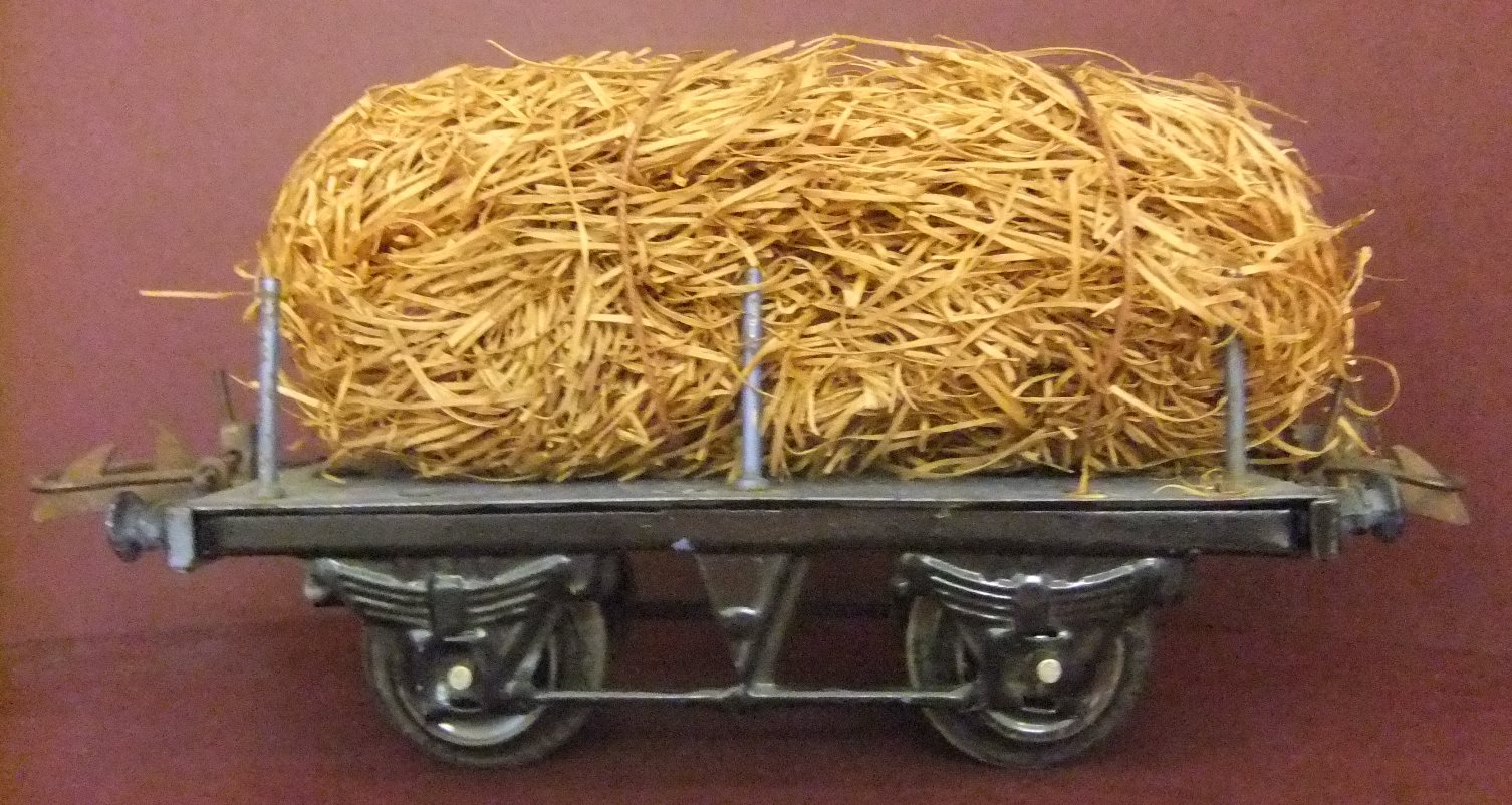 Hornby 0-scale Stake wagon with fibre load