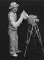 Edwardian beach photographer with tripod