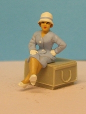 Omen - Seated woman wearing a cloche hat 1920's
