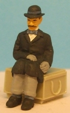 Omen - Seated man wearing a bowler hat