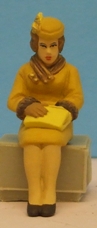 Omen - Seated woman looking inrto her handbag