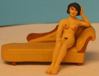 Omen - Nude girl recling on a chaise longue 