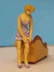Omen - Girl wearing a corset and tying her garter