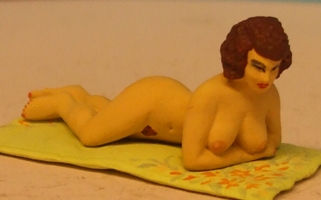 Omen - Nude girl lying on a towel 