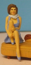Omen - Seated girl, holding a raised knee