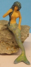 Omen - Mermaid seated with her tail down in front