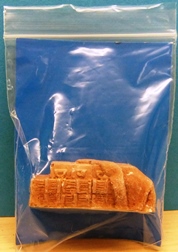 Unknown Maker Crates part covered by tarpaulin